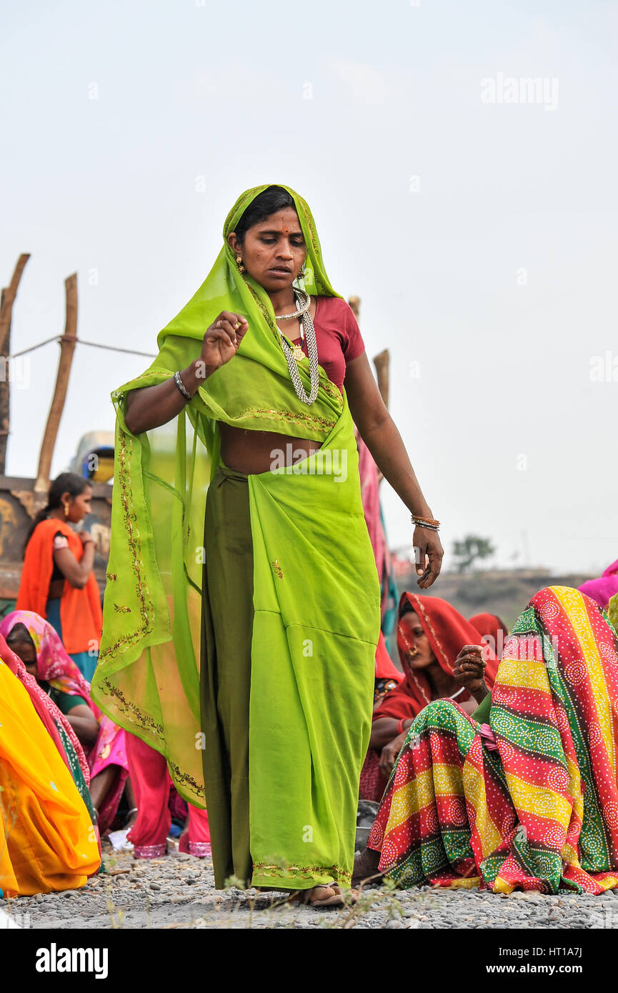 Rajasthani Bhil woman in a lime green sari Stock Photo