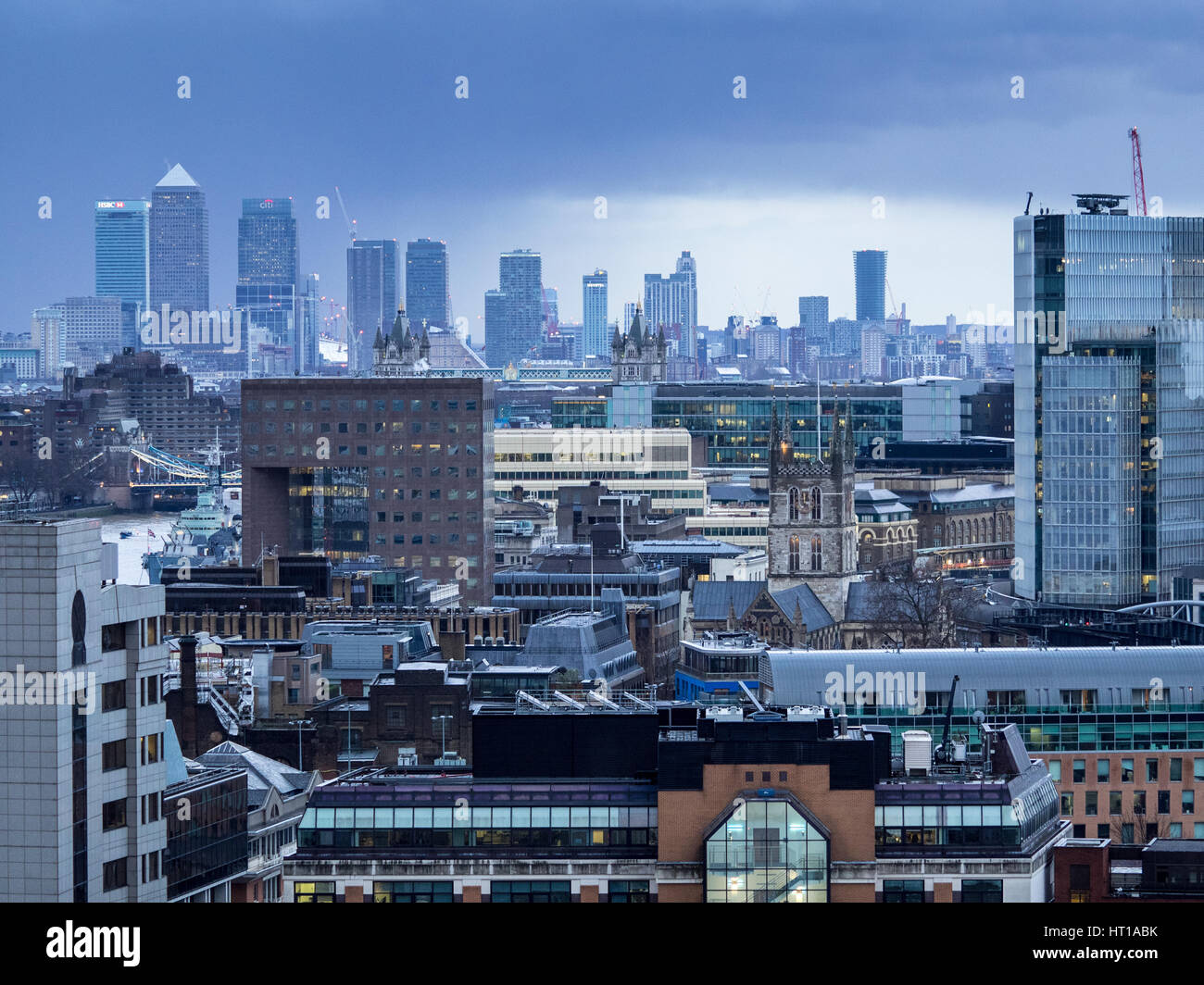 London Cityscape to Canary Wharf under dark skies in the distance Stock Photo