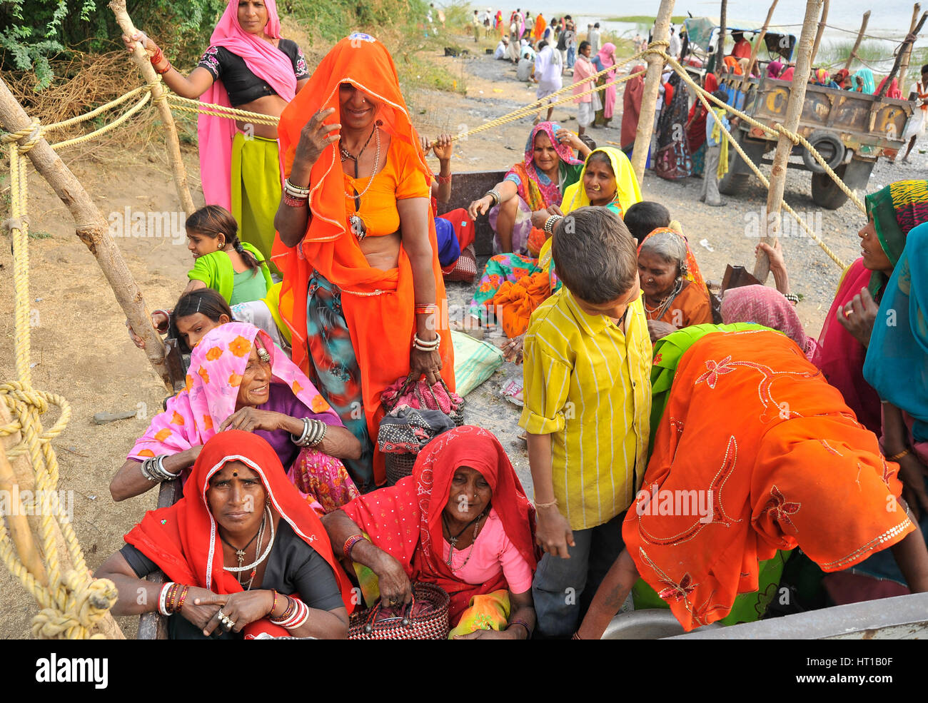 Rajasthani women and children on a trailer on the back of a tractor Stock Photo