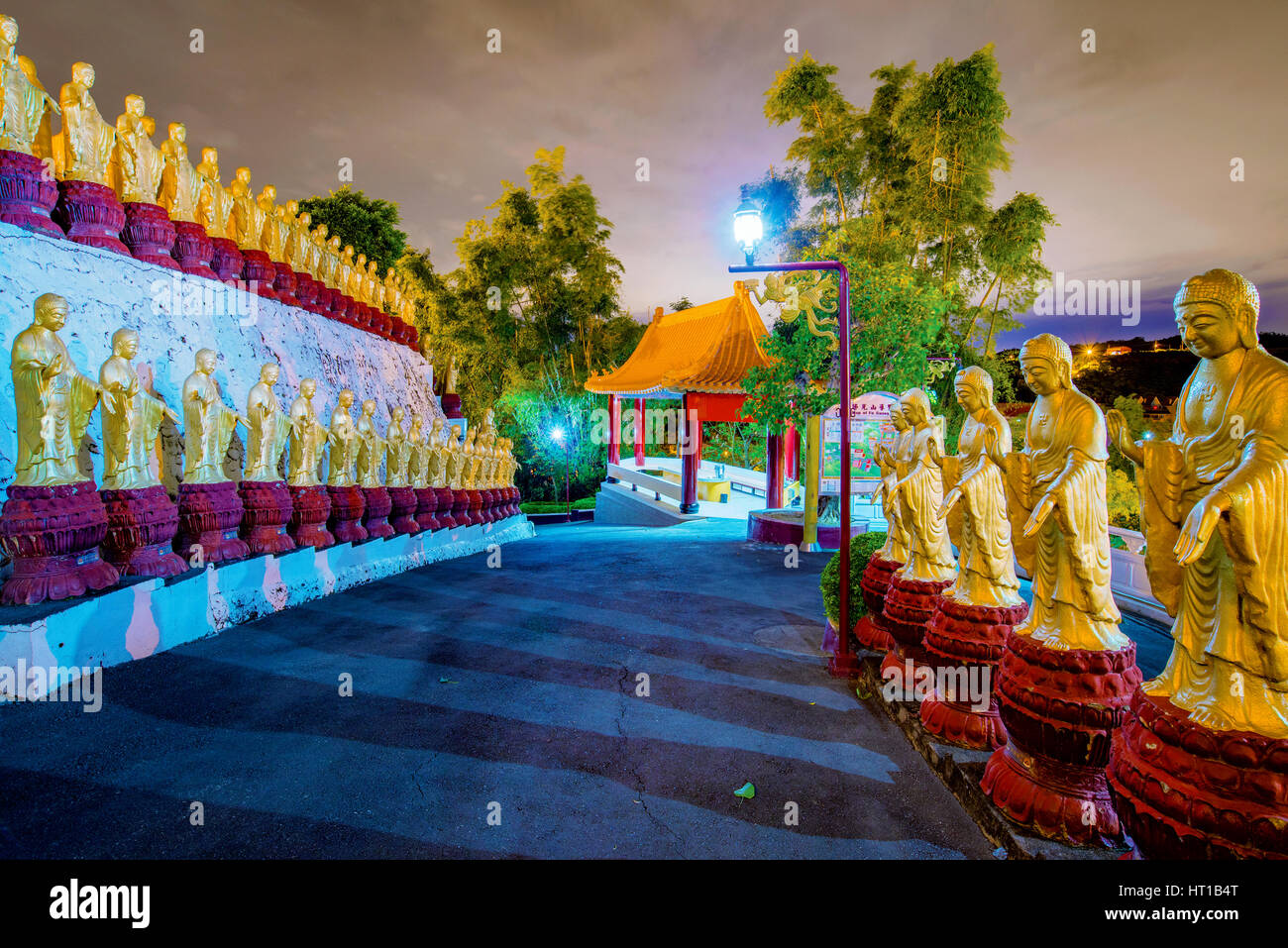 Buddha statues and temple at night Stock Photo