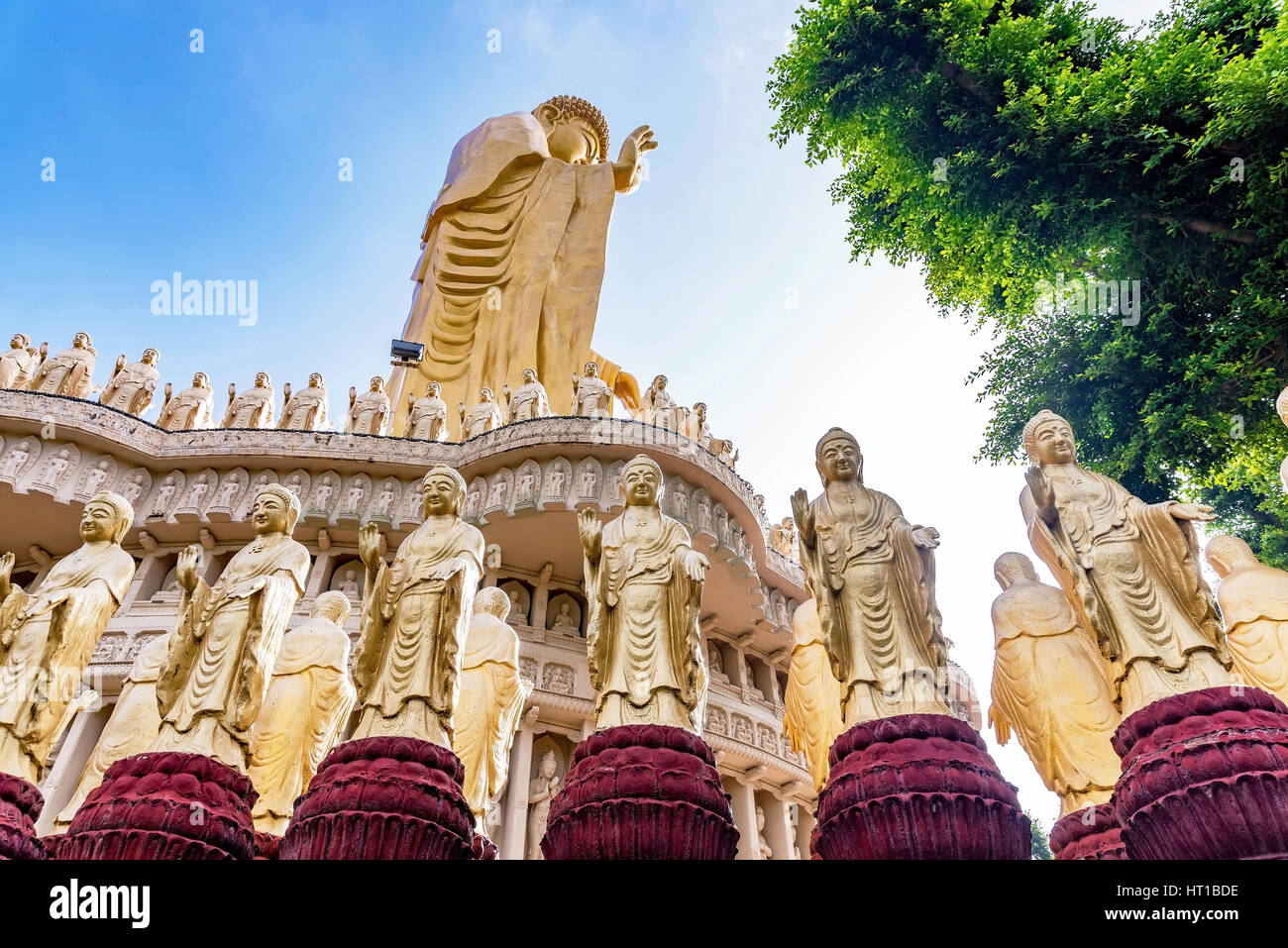 Buddha statues with large gold buddha and nature Stock Photo