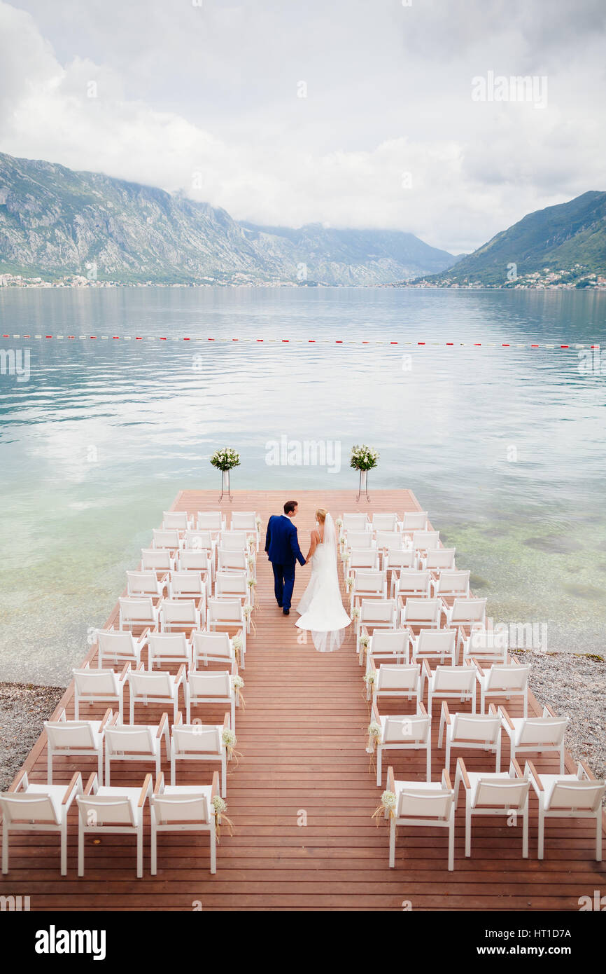 Wedding Couple At Destination Wedding Ceremony Mountains And Sea