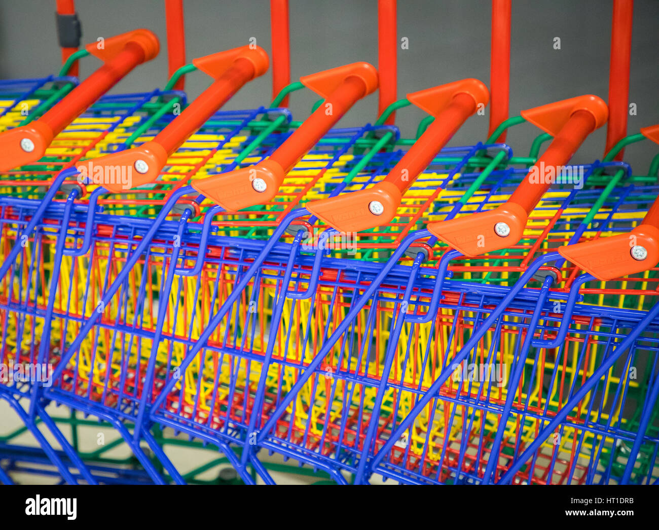 many shopping colorful shopping trolleys together Stock Photo Alamy