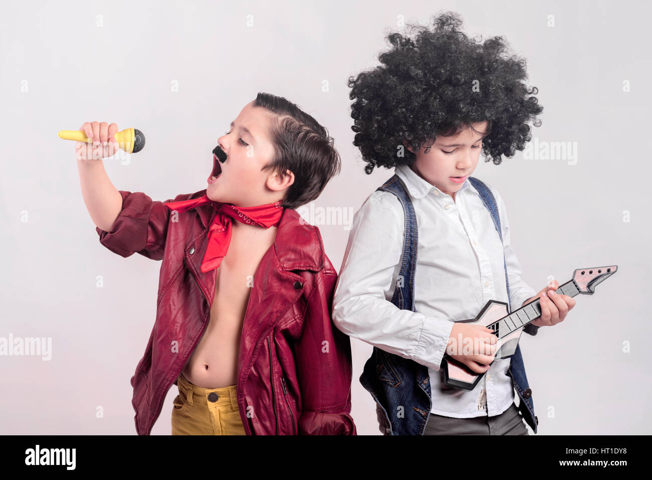 like a rock star,  Children disguised as rock stars Stock Photo