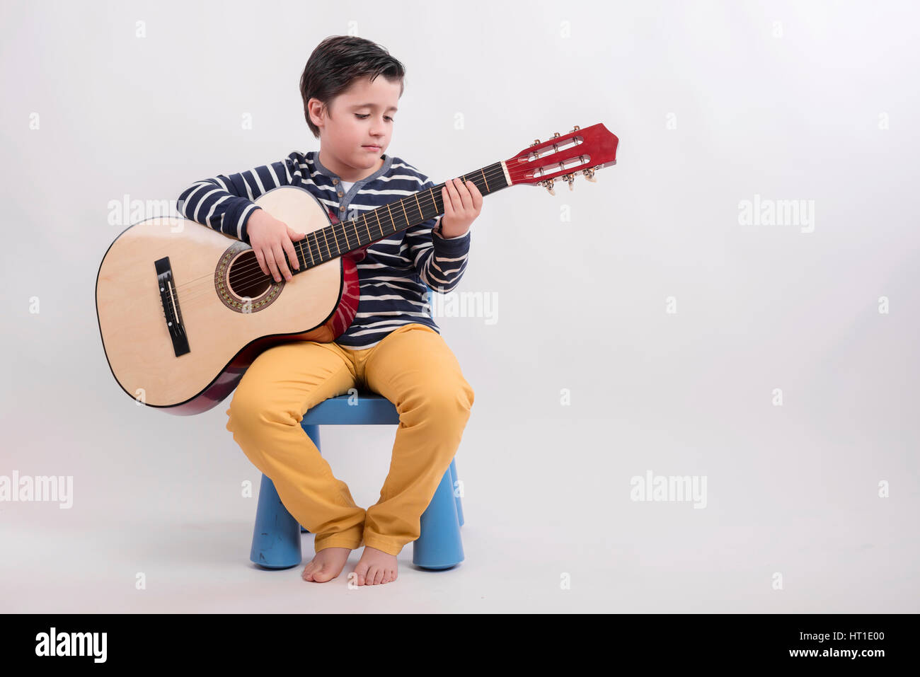 boy to play guitar Stock Photo