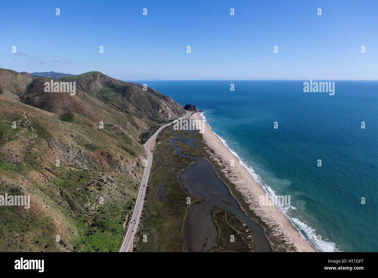 Aerial view of Pacific Coast Highway and Mugu Rock north of Malibu in Ventura County, California. Stock Photo
