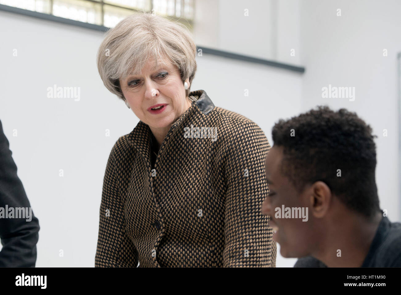Prime Minister Theresa May talks with student Charles Kanda in a mathematics class during a visit to King's College London Mathematics School in central London as more than half a billion pounds is to be pumped into creating new free schools, including grammars, and refurbishing existing school buildings, the Government has said. Stock Photo