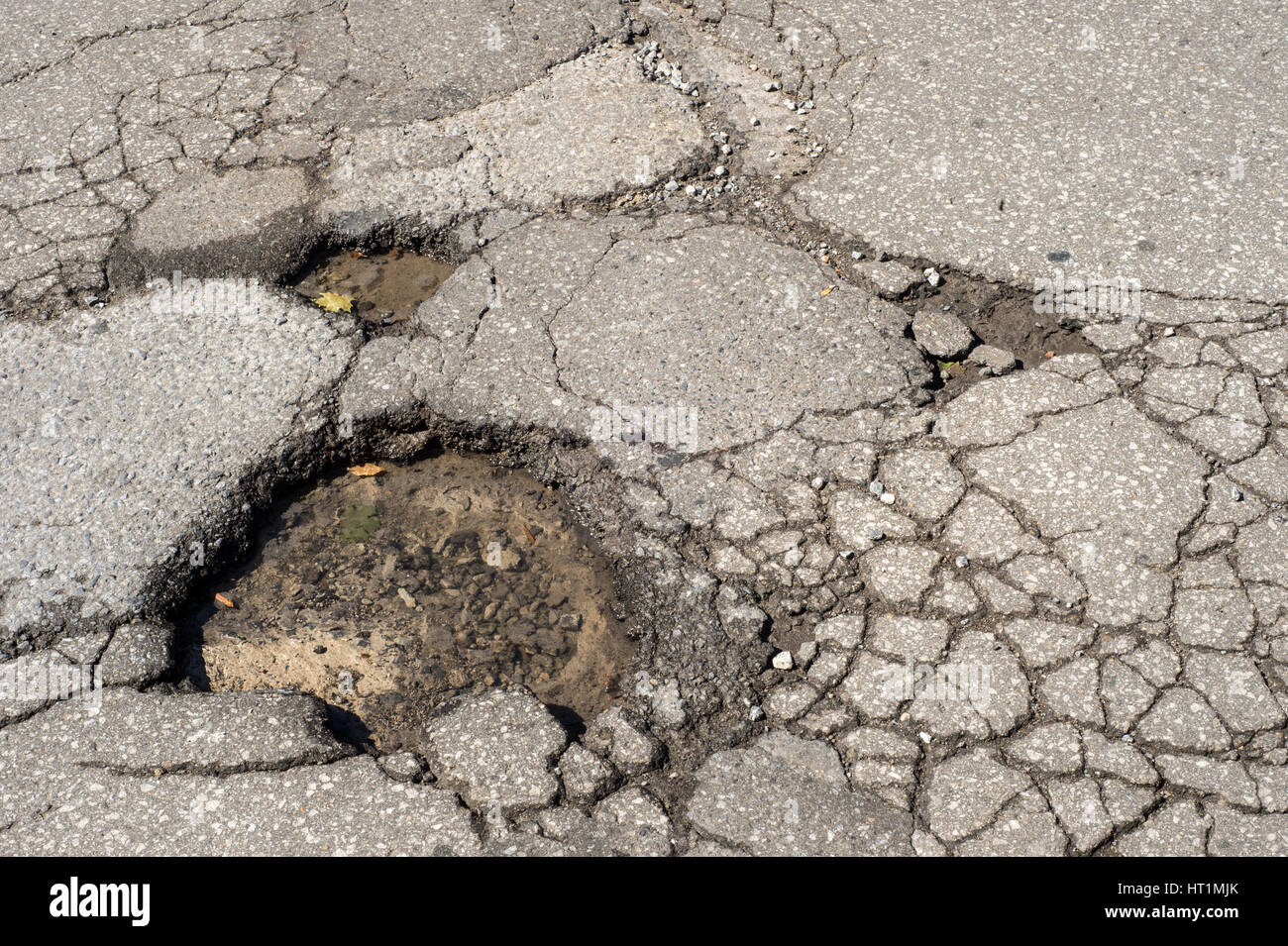 Large deep pothole in Montreal street, Canada. Stock Photo