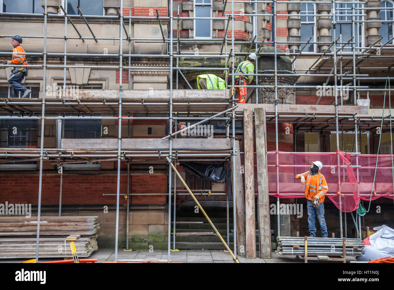 Men working on scaffolding in Durham,England,UK Stock Photo