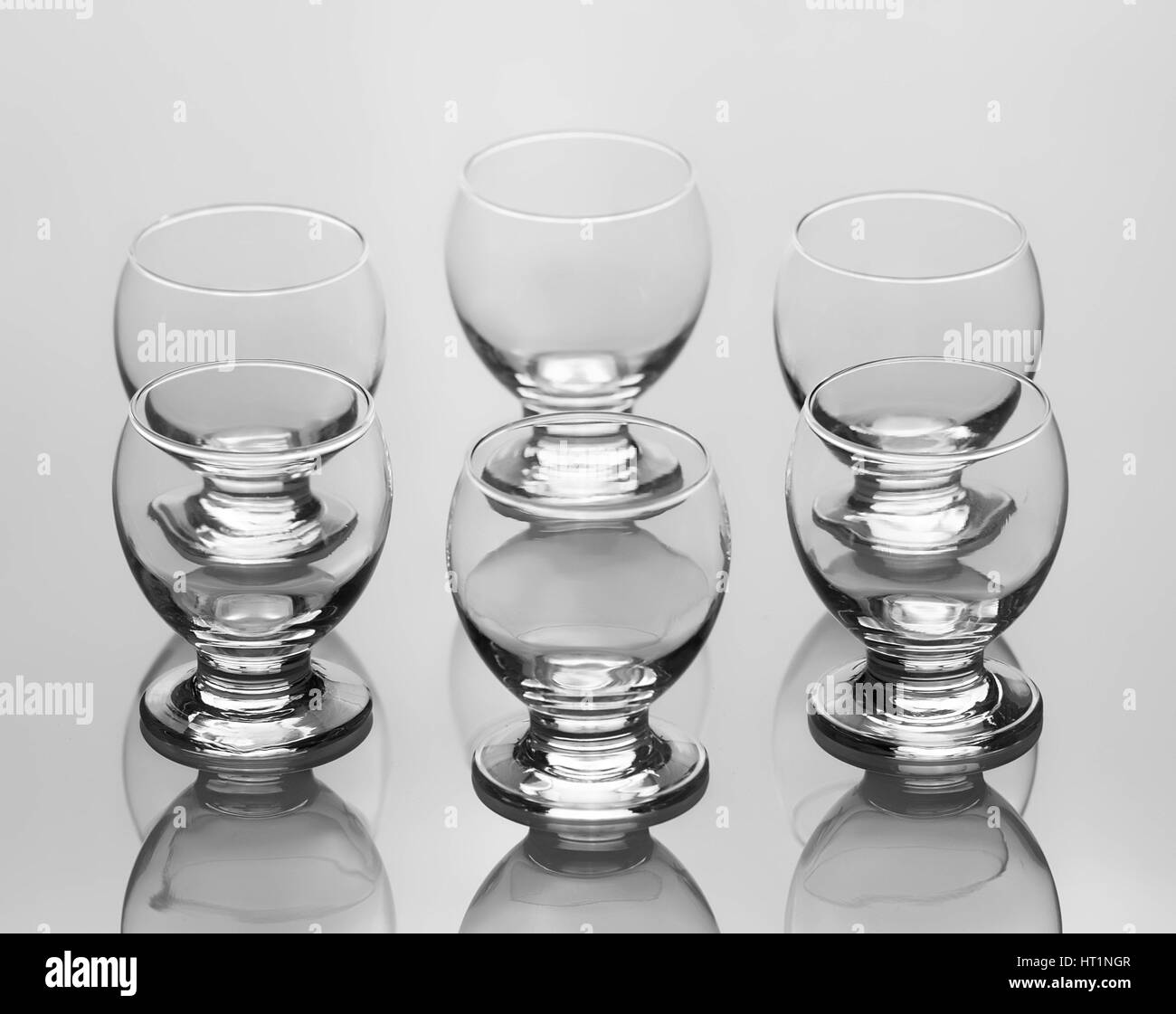 Set of six empty liqueur glass isolated on white background Stock Photo