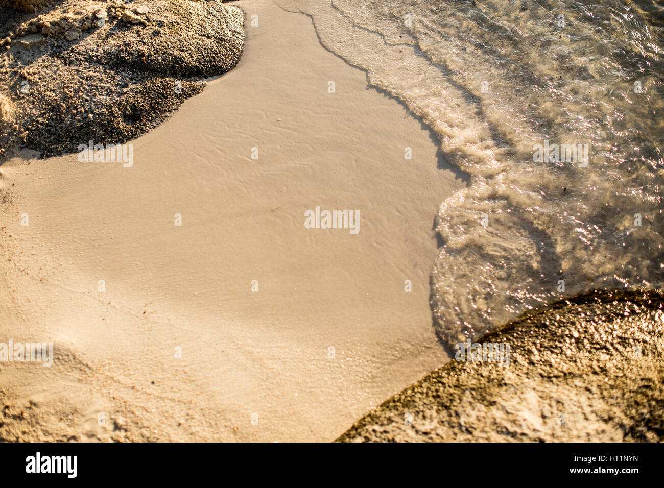 Close up of soft wave of sea on sandy beach Stock Photo - Alamy