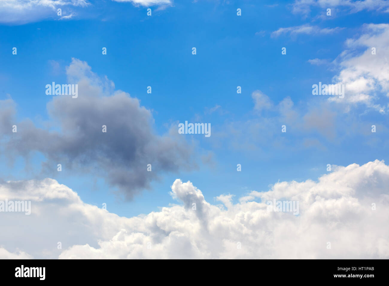 Blue sunny sky with white clouds background Stock Photo - Alamy