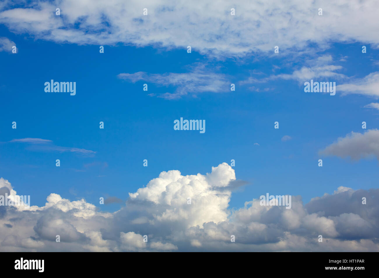 Blue sunny sky with white clouds background Stock Photo - Alamy