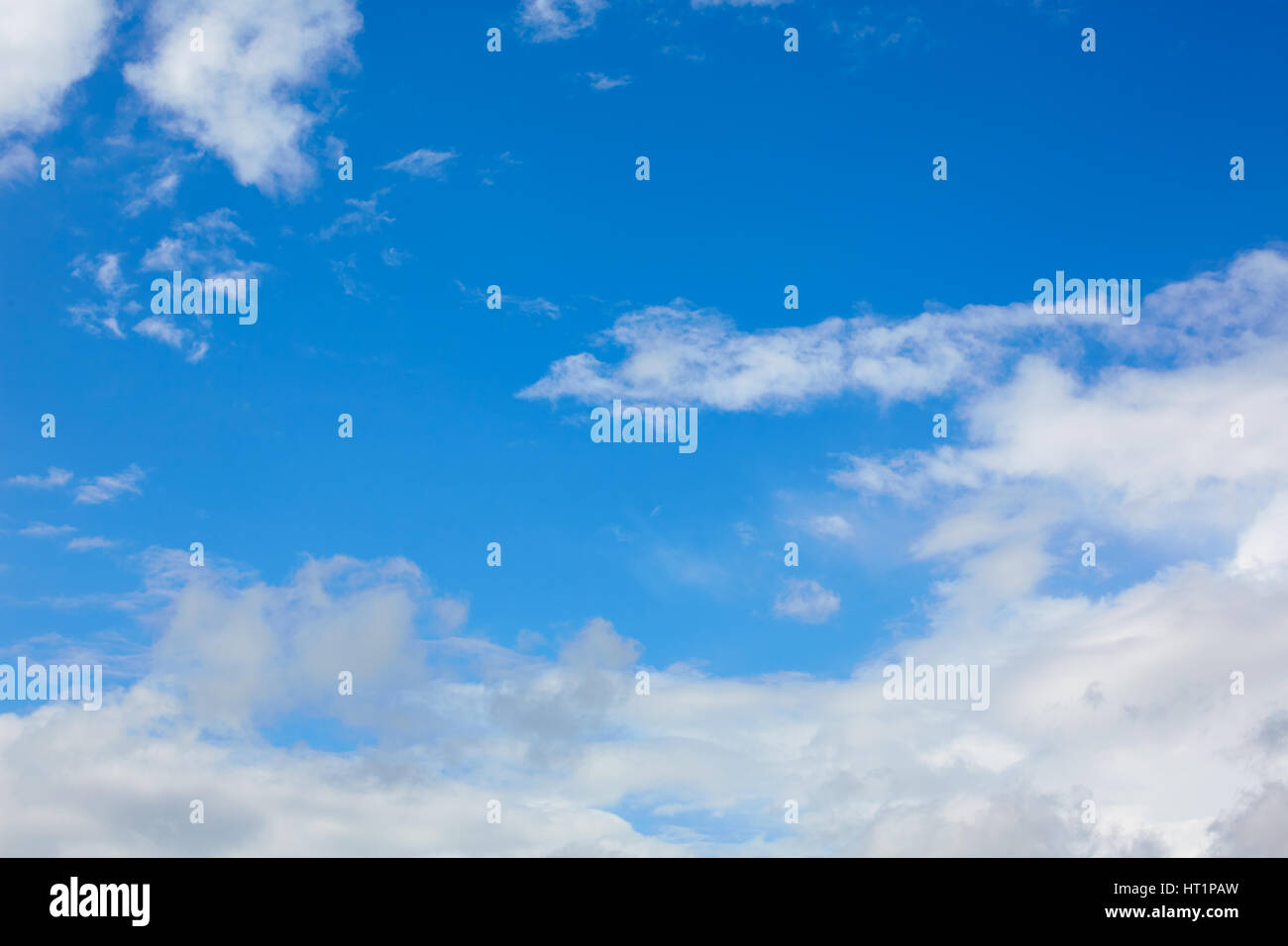 Blue sunny sky with white clouds background Stock Photo - Alamy