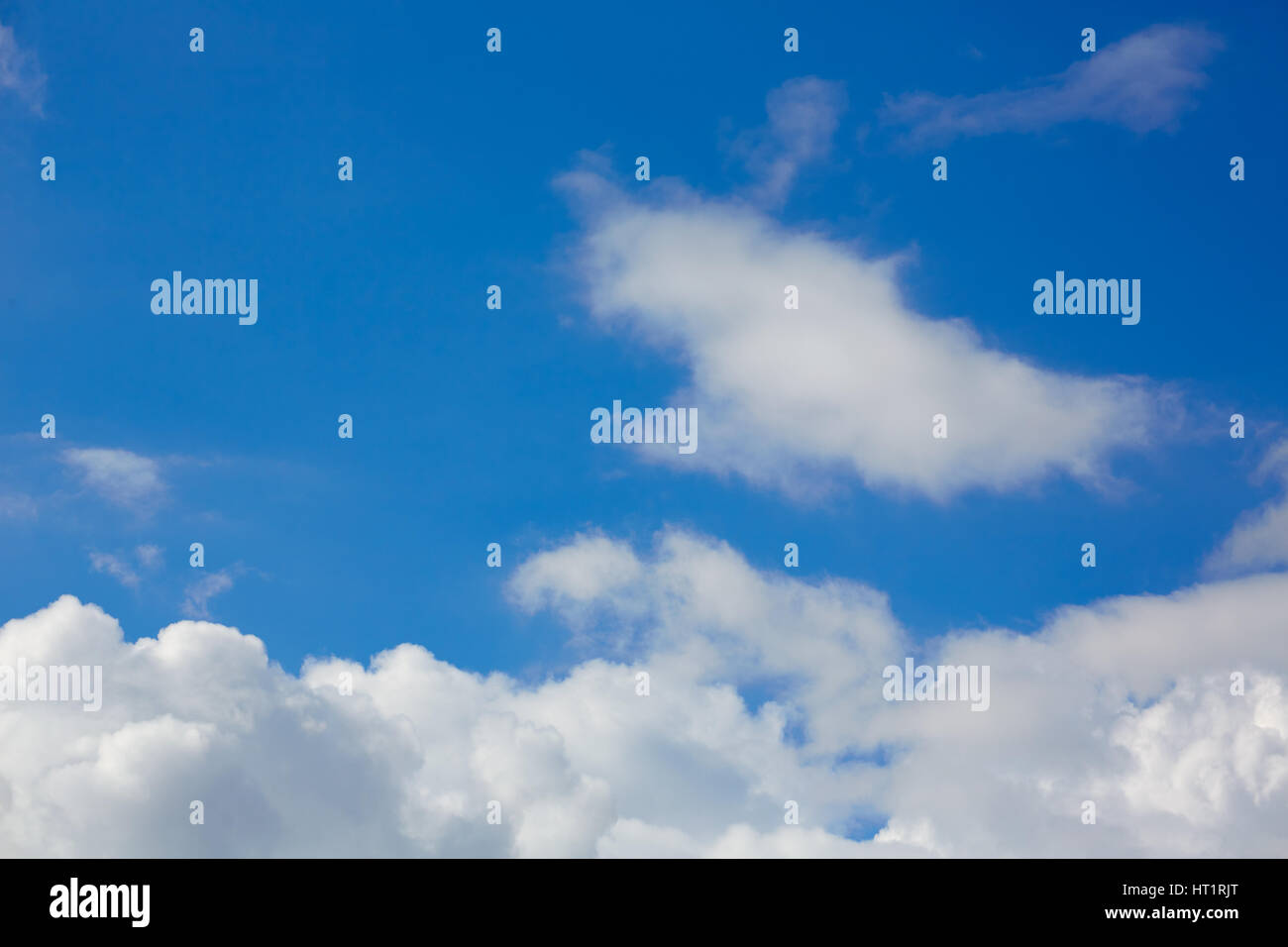 Blue sunny sky with white clouds background Stock Photo - Alamy