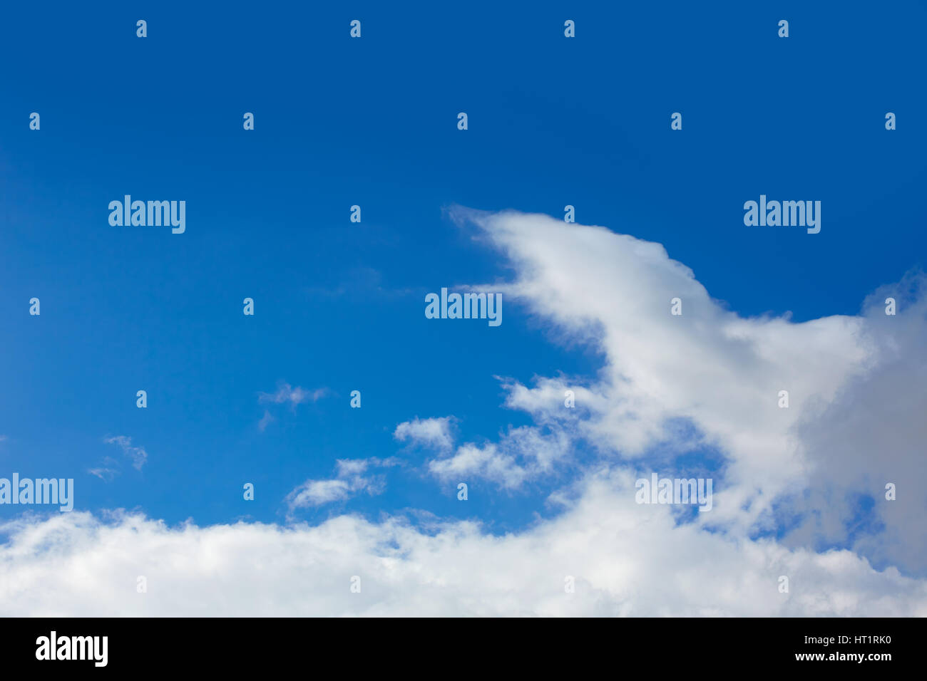 Blue sunny sky with white clouds background Stock Photo - Alamy
