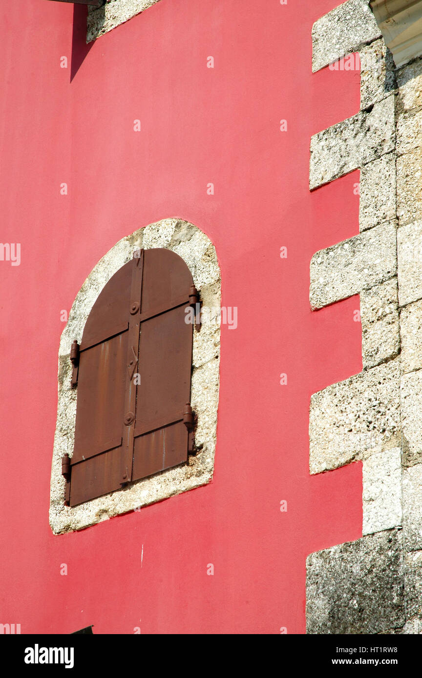 Old window on a red wall Stock Photo - Alamy