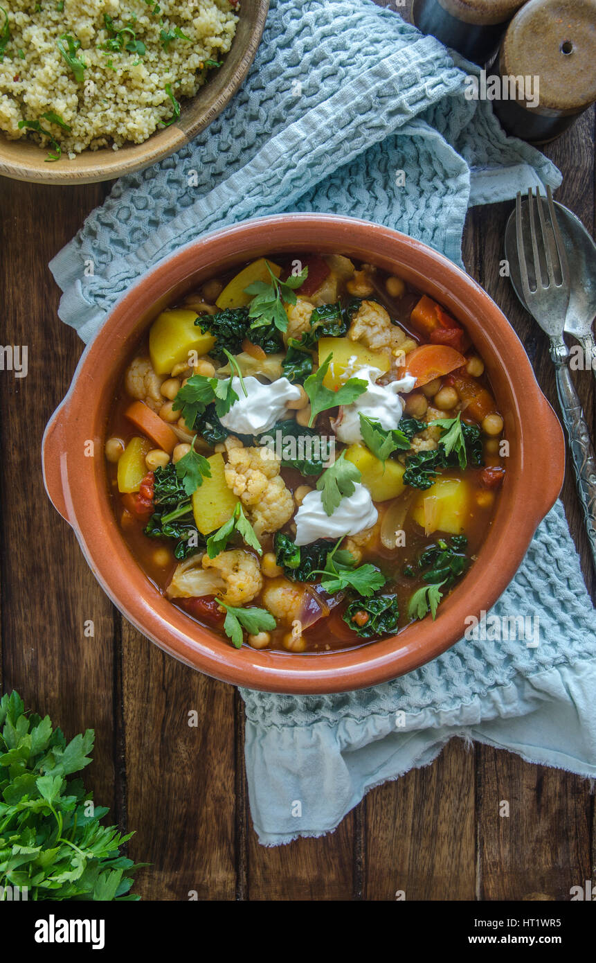 Moroccan chickpea and cauliflower tagine with couscous Stock Photo Alamy