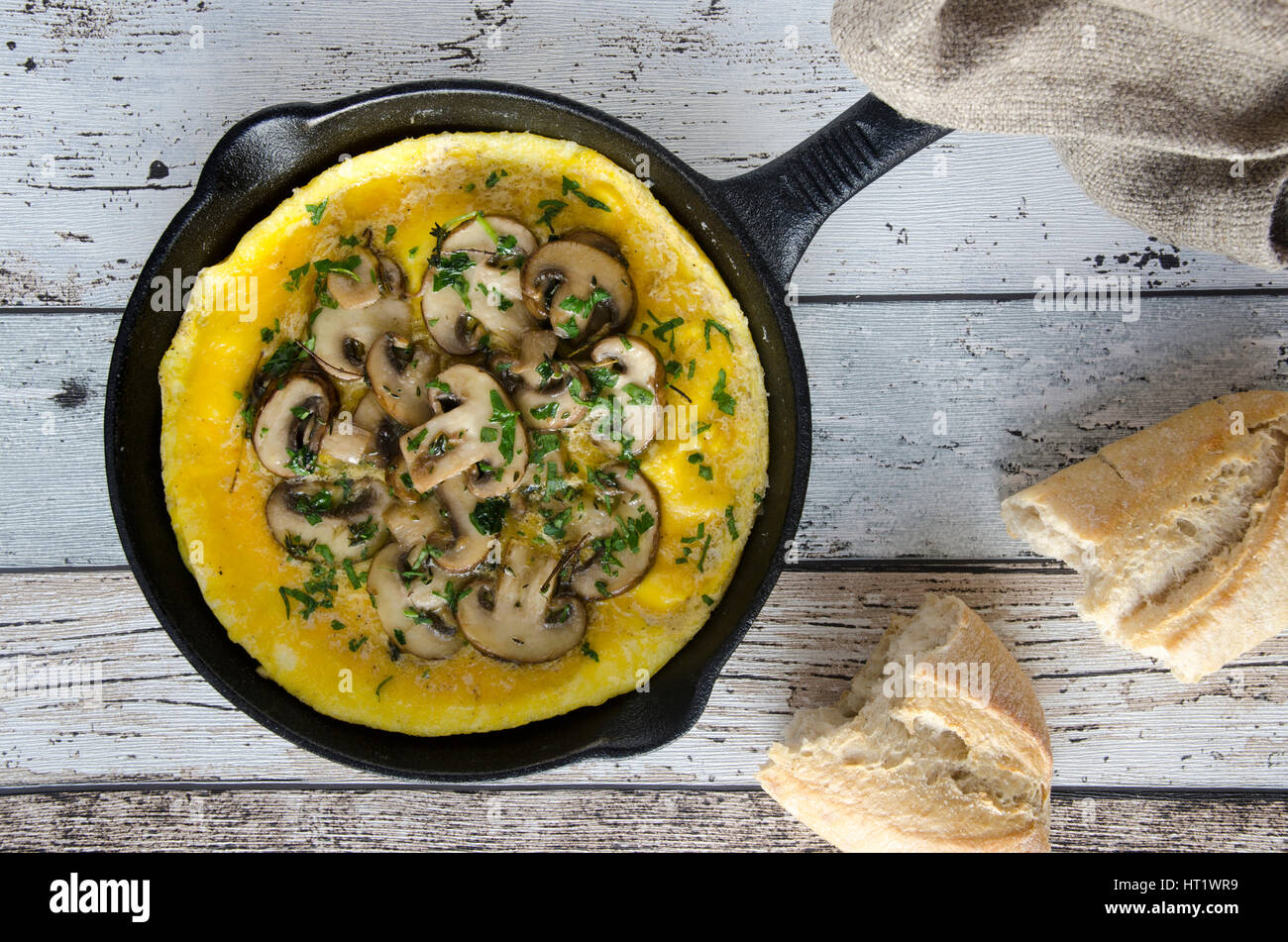 Egg and chestnut mushroom omelette in a pan Stock Photo - Alamy