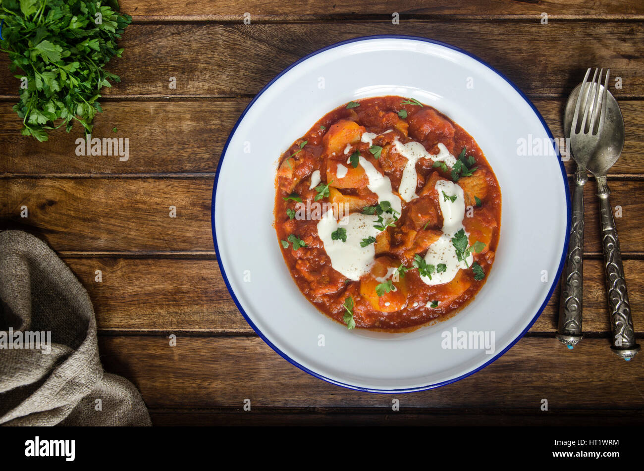 Pork and paprika goulash with soured cream Stock Photo Alamy