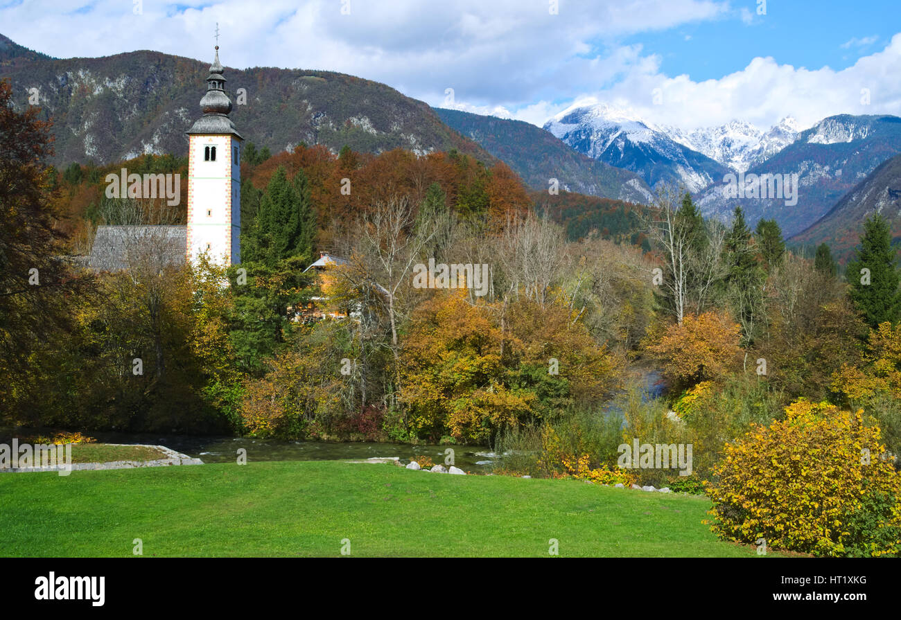 Autumn view of the Church of St. John the Baptist near the Lake Bohinj (Bohinjsko jezero), Slovenia Stock Photo