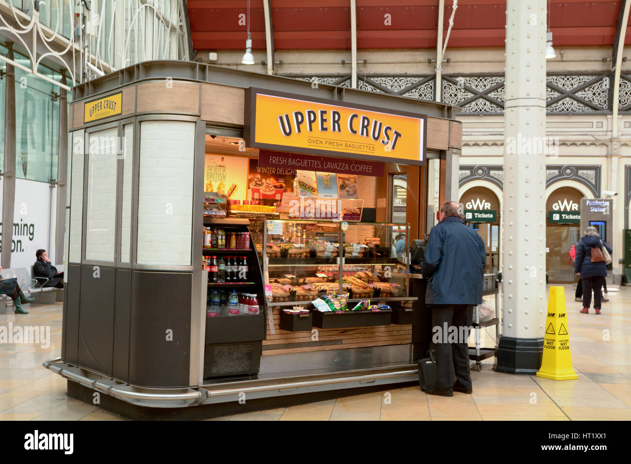 Man buying sandwich from an Upper Crust sandwich shop in Paddington