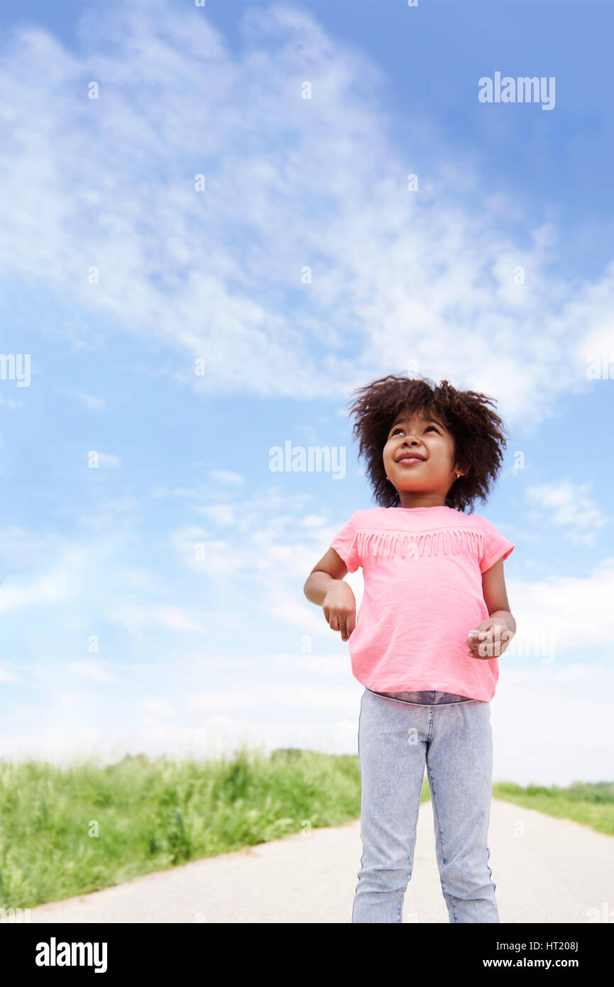 Little african girl can conquer the world Stock Photo