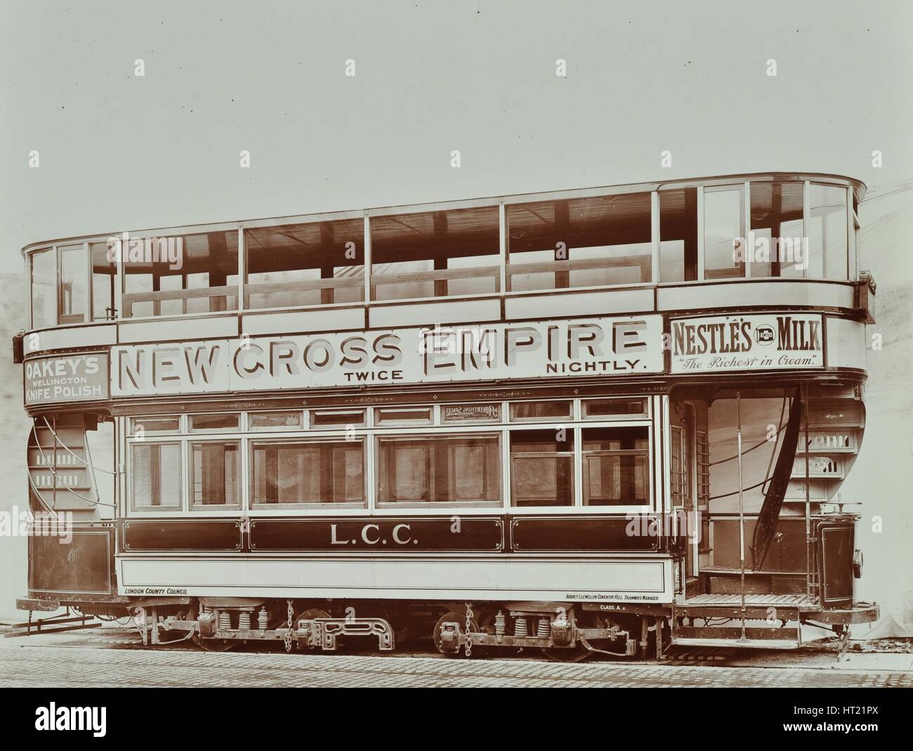 Double-decker electric tram with advertisement for the New Cross Empire, 1907. Artist: Unknown. Stock Photo