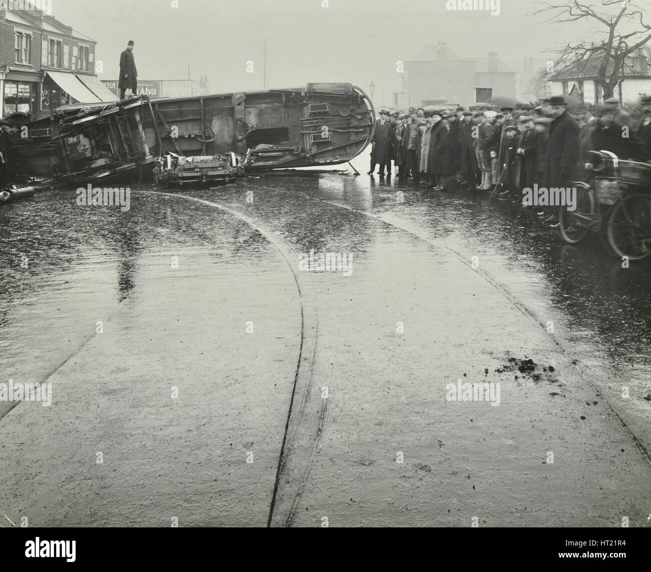 Overturned electric tram and onlookers, London, 1913. Artist: Unknown. Stock Photo