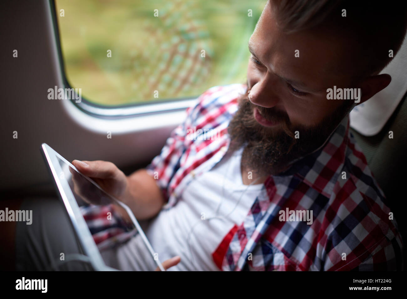 Man using the digital tablet during the travel Stock Photo