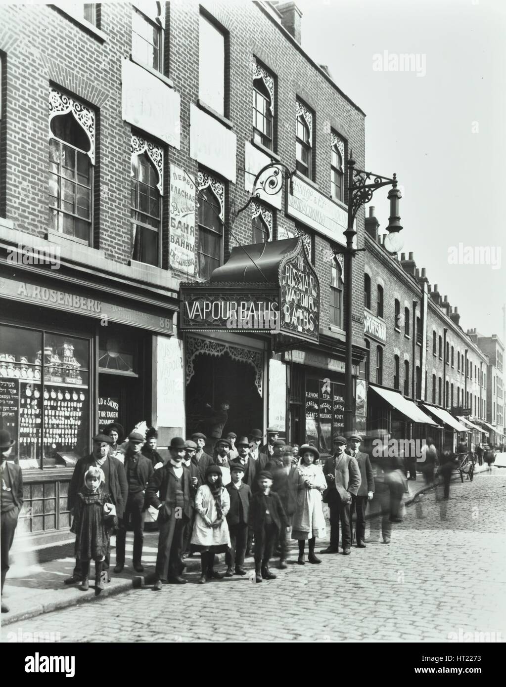 Crowd outside the Russian Vapour Baths, Brick Lane, Stepney, London, 1904. Artist: Unknown. Stock Photo