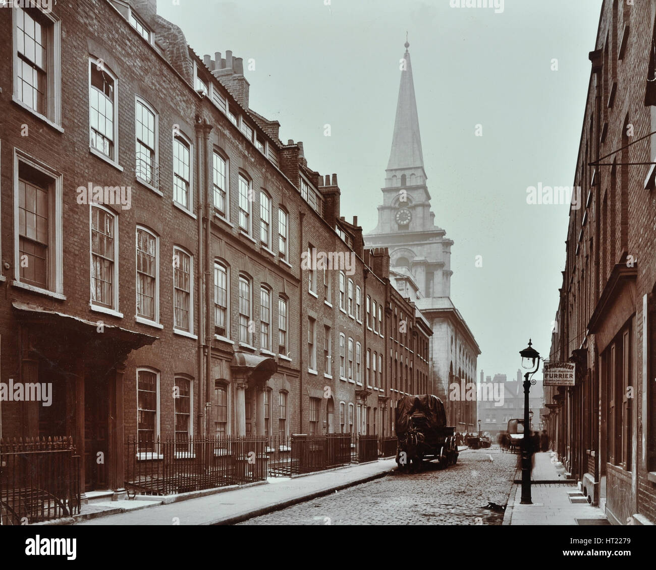 Georgian terraced houses and Christ Church, Spitalfields, Stepney, London, 1909. Artist: Unknown. Stock Photo