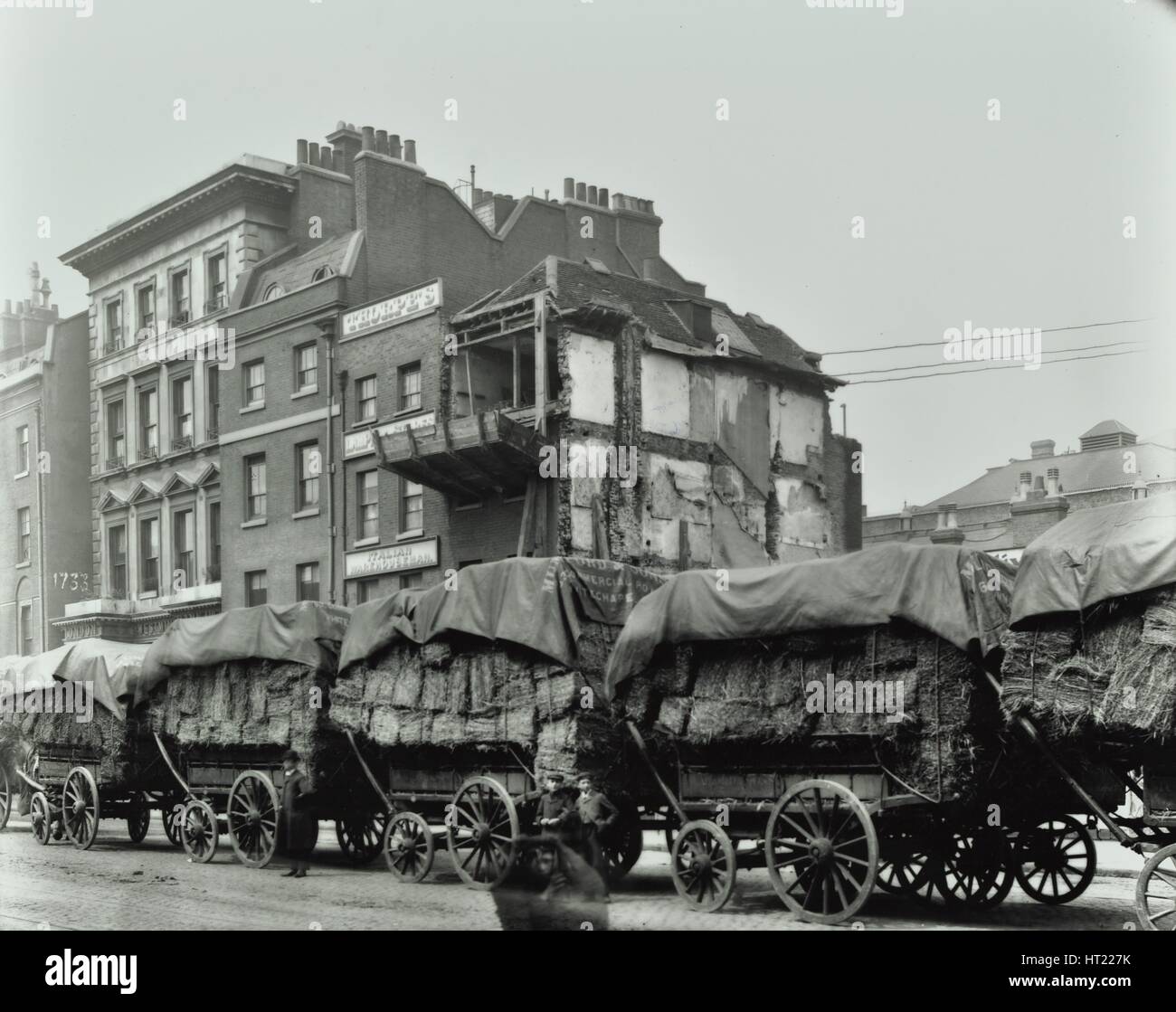 Hay wagons, Whitechapel High Street, London, 1903. Artist: Unknown. Stock Photo