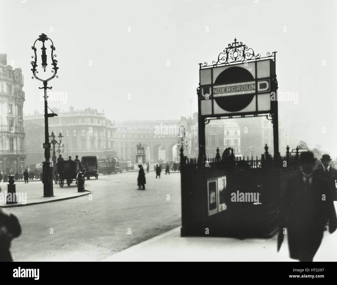 Trafalgar Square with Underground entrance and Admiralty Arch behind, London, 1913. Artist: Unknown. Stock Photo
