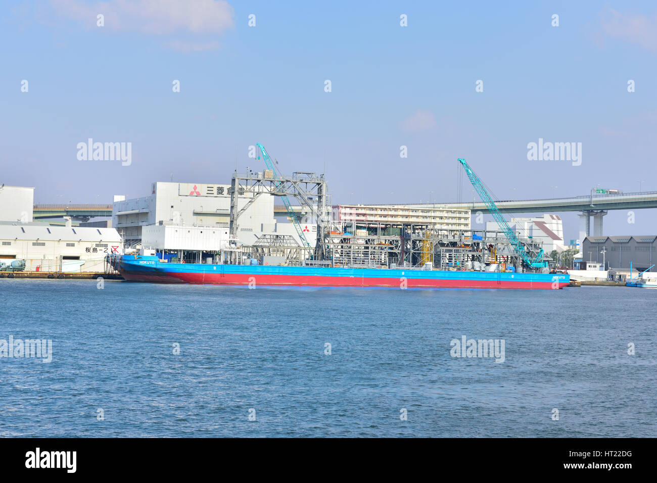 OSAKA, JAPAN NOVEMBER 07, 2014 Cargo ship being loaded at Tempozan