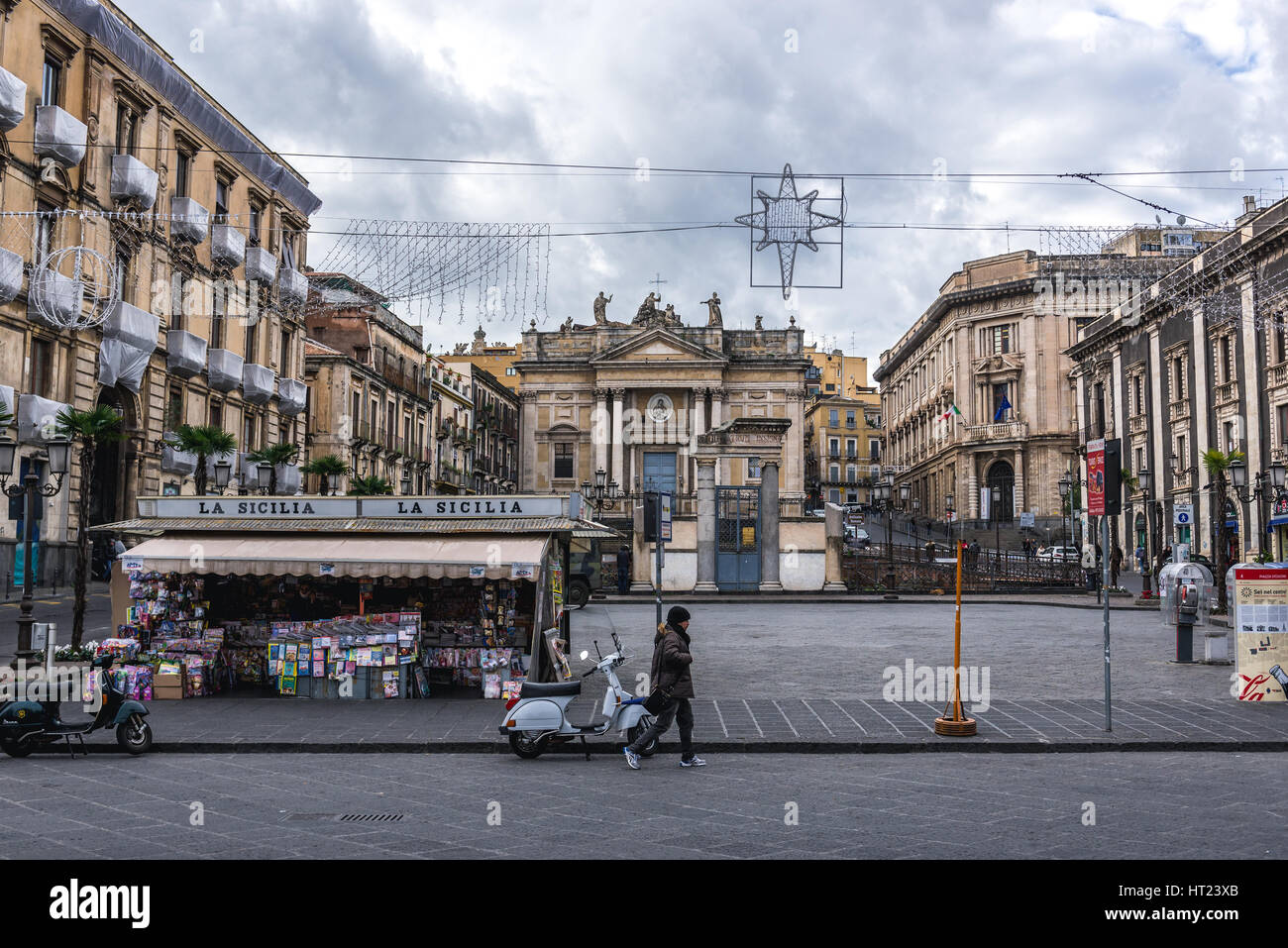 Newsstand on Piazza Stesicoro (Stesicoro Square) in Catania city on the east side of Sicily Island, Italy. San Biagio church on background Stock Photo
