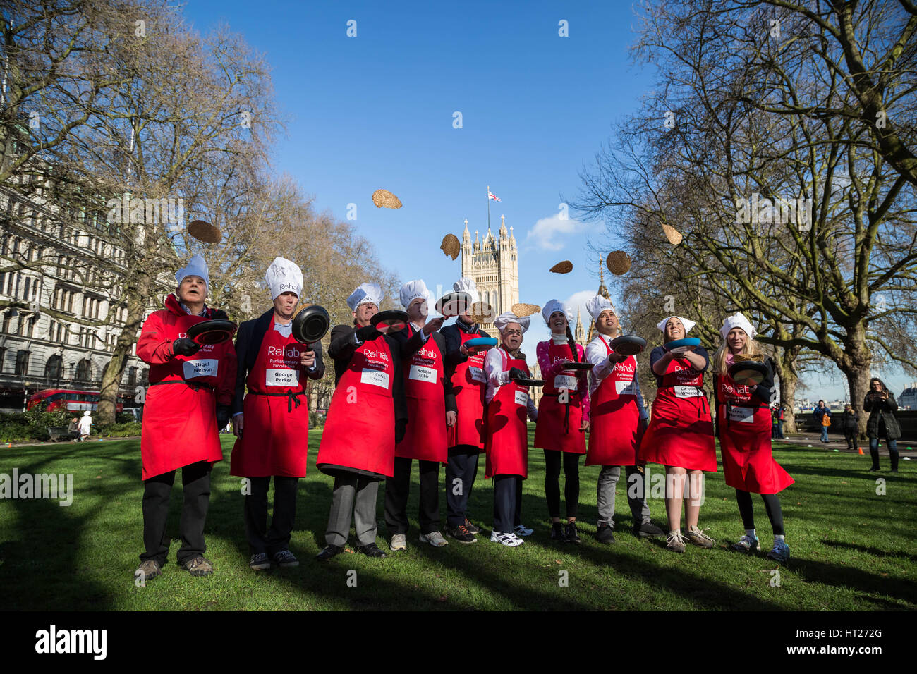 L-R Nigel Nelson, George Parker, Michael Crick, Robbie Gibb, James Landale, Alastair Stewart, Mia Wormesley, Fasial Islam, Caroline Wheeler and Jane Merrick. MPs, Lords and Media attend the 20th Annual Rehab Parliamentary Pancake Race at Victoria Gardens in Westminster, London, UK. Stock Photo