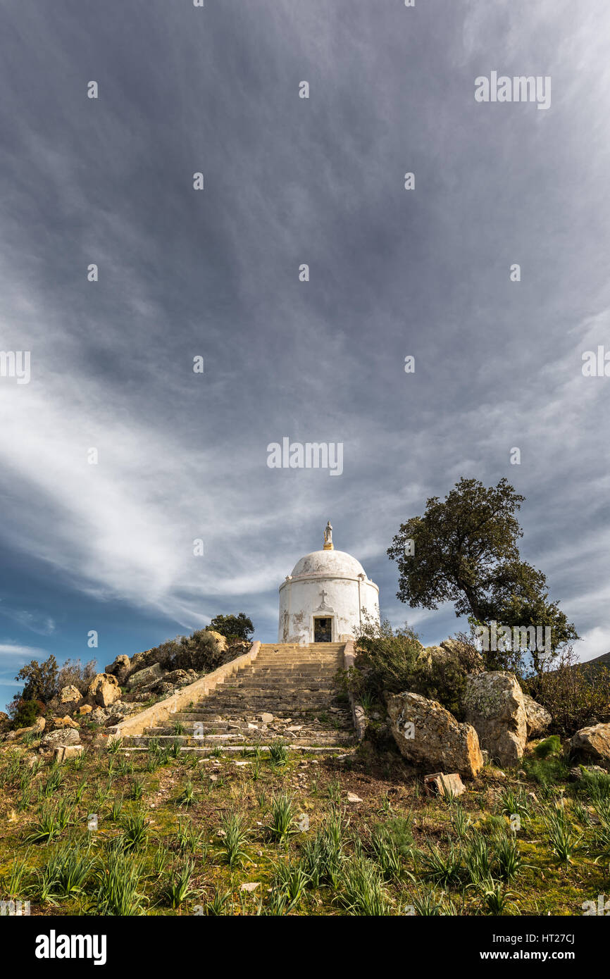 Wispy clouds above the steps leading to a large white domed mausoleum at Palasca in the Balagne region of Corsica Stock Photo