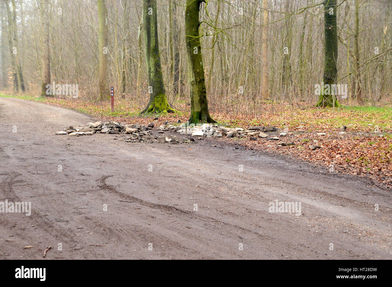 Sonderborg, Denmark - April 6, 2014: Illegally dumped construction waste in nature, appearently from a wall that had been torn down. Stock Photo