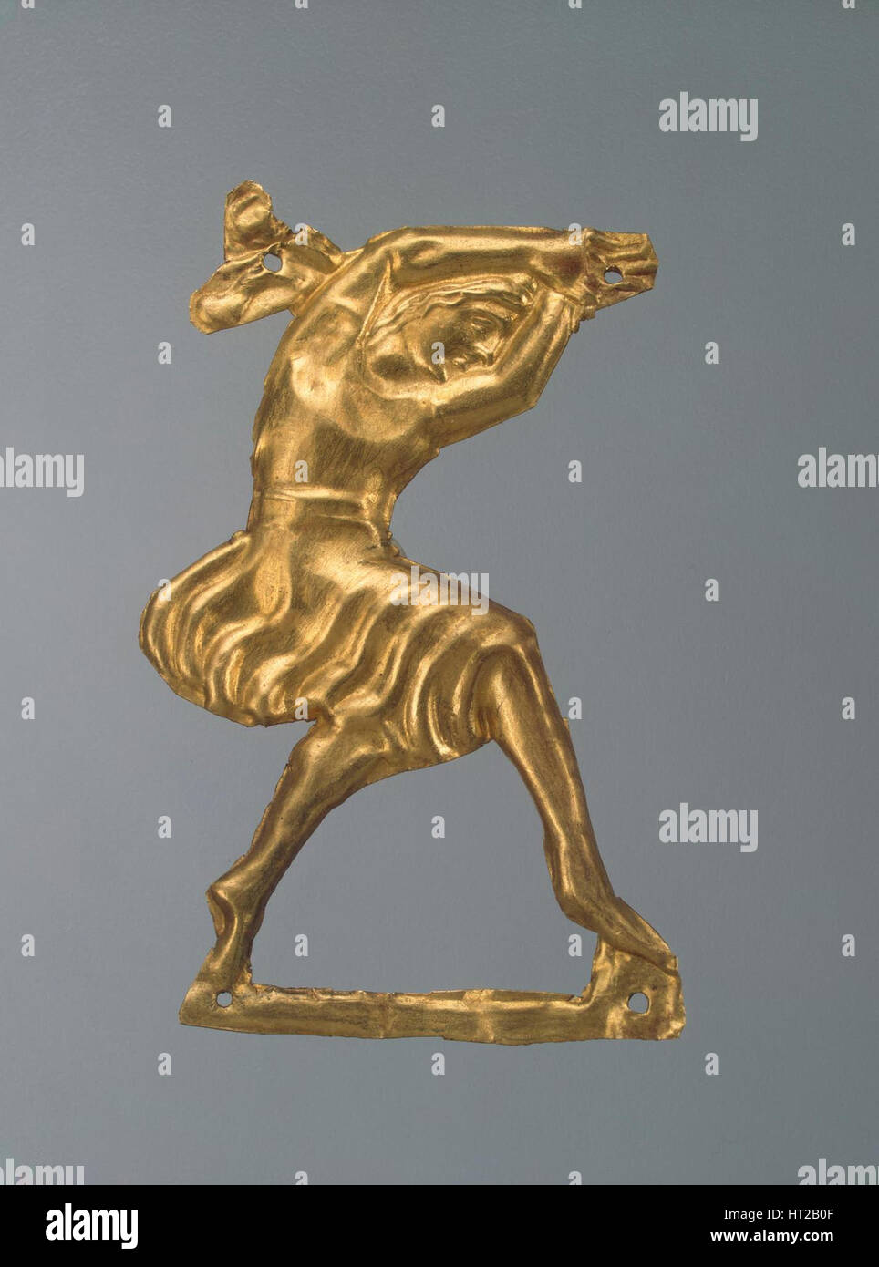 Gold plaque in the form of a dancing woman, 330-300 BC. Artist: Ancient jewelry Stock Photo