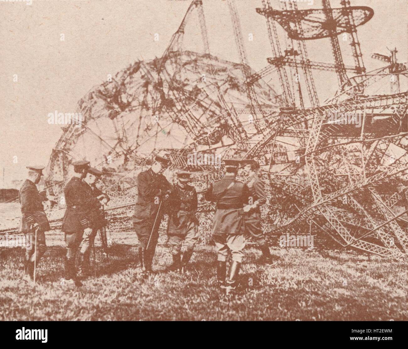 British staff officers examining the wreckage of a Zeppelin brought down in England, c1917 (1919). Artist: Unknown. Stock Photo