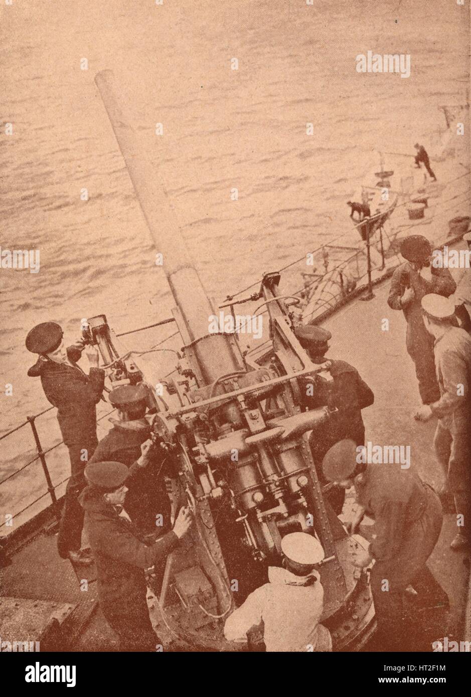 An anti-aircraft gun in action on a British battleship, c1917 (1919). Artist: Unknown. Stock Photo