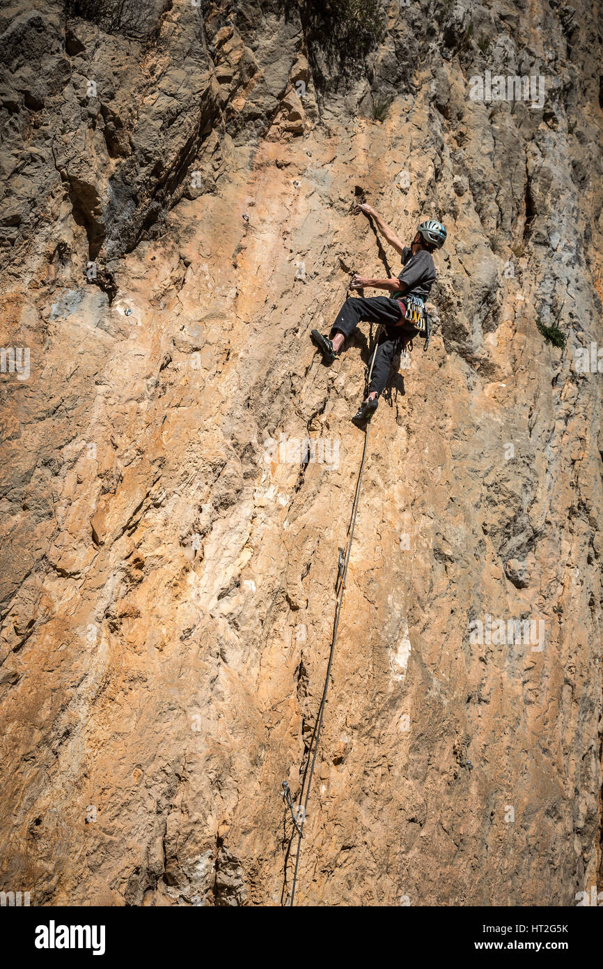 Climber rock climbing on the Costa Blanca, Tarbena, Spain, Europe. Stock Photo