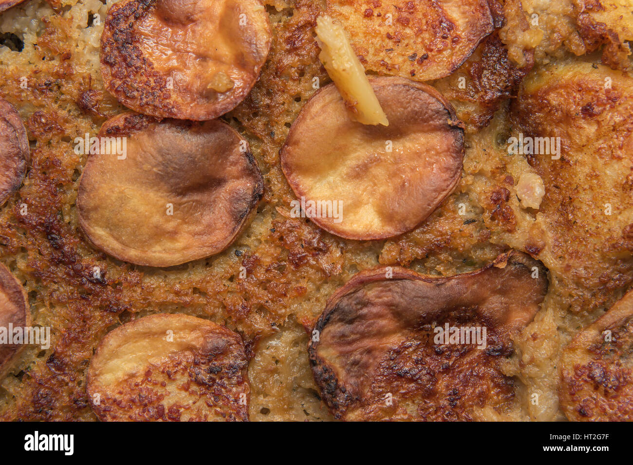 Crunchy Potato Serbian Moussaka with minced pork meat and eggs baked in high temperature oven, closeup with creative lighting Stock Photo