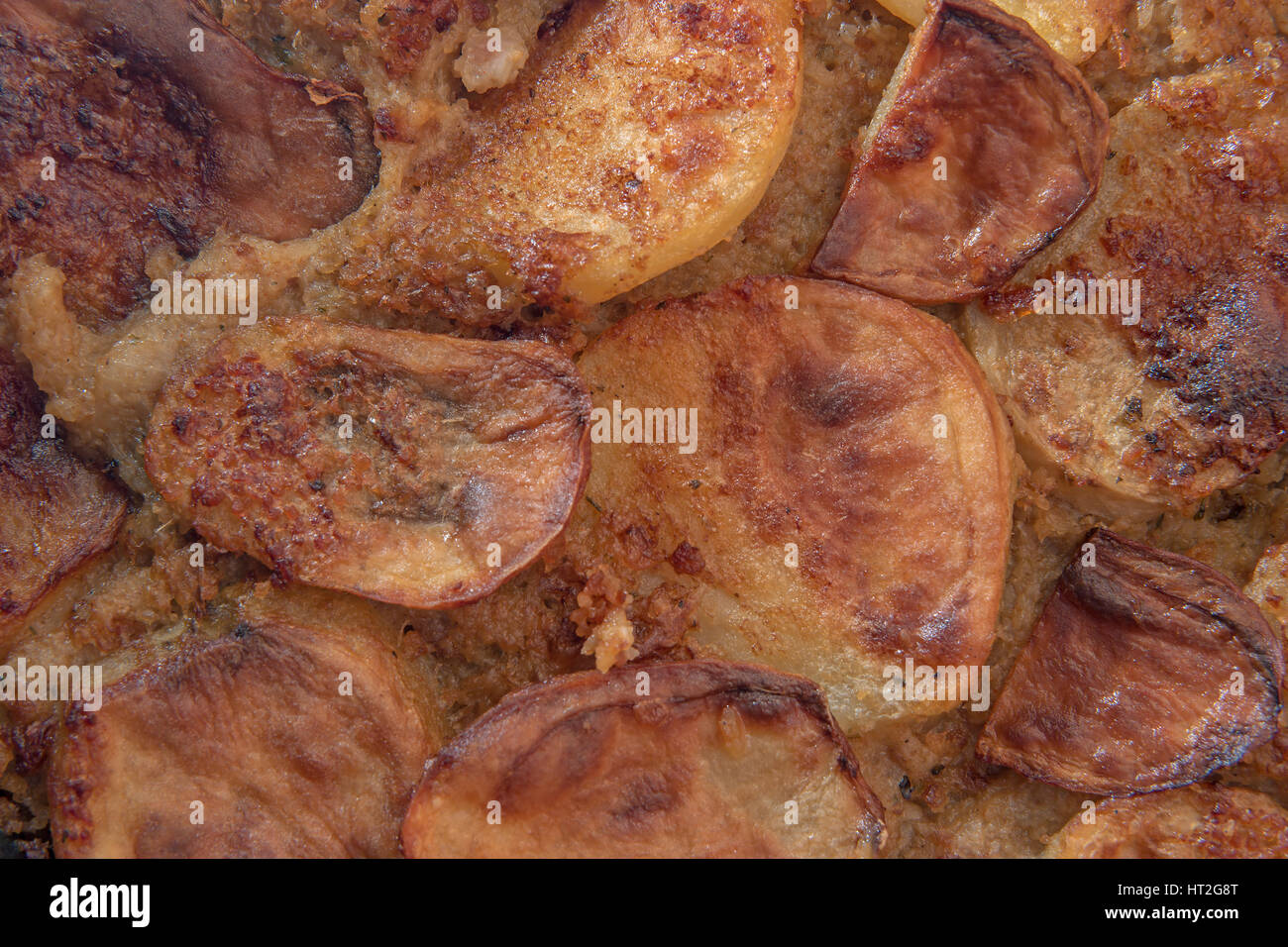 Crunchy Potato Serbian Moussaka with minced pork meat and eggs baked in high temperature oven, closeup with creative lighting Stock Photo
