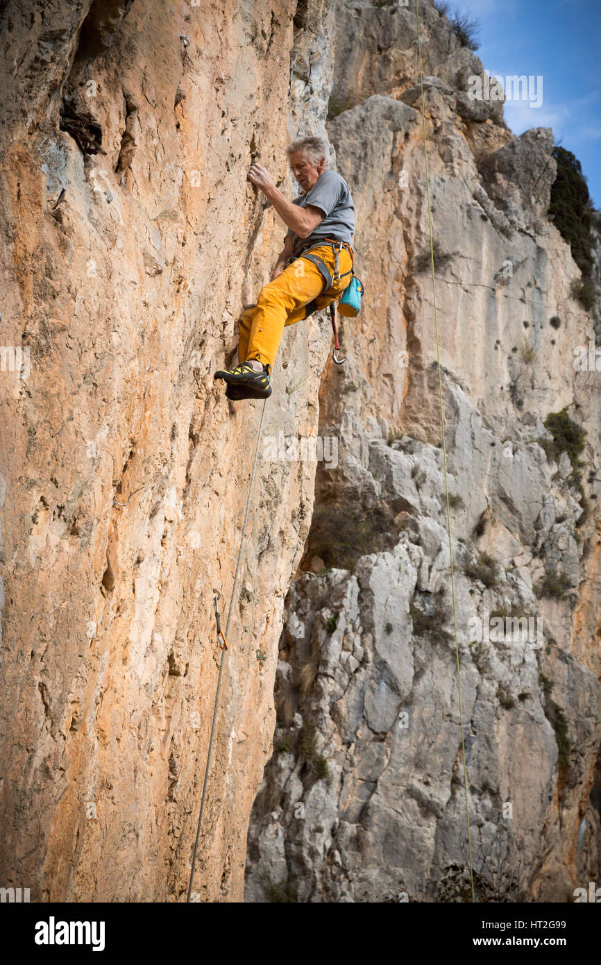 Climber rock climbing on the Costa Blanca, Tarbena, Spain, Europe Stock