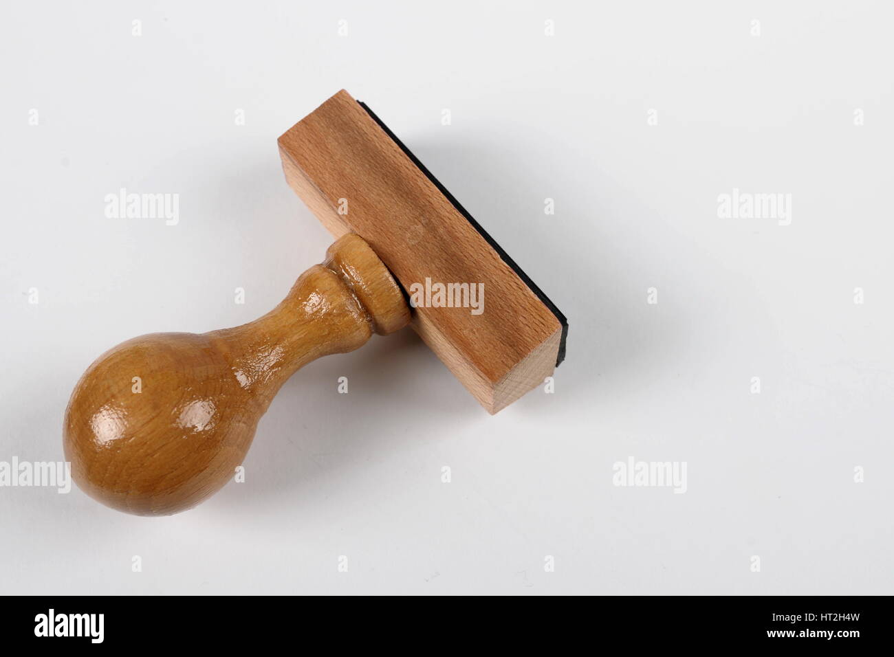 Wooden Rubber stamp isolated on white background Stock Photo - Alamy
