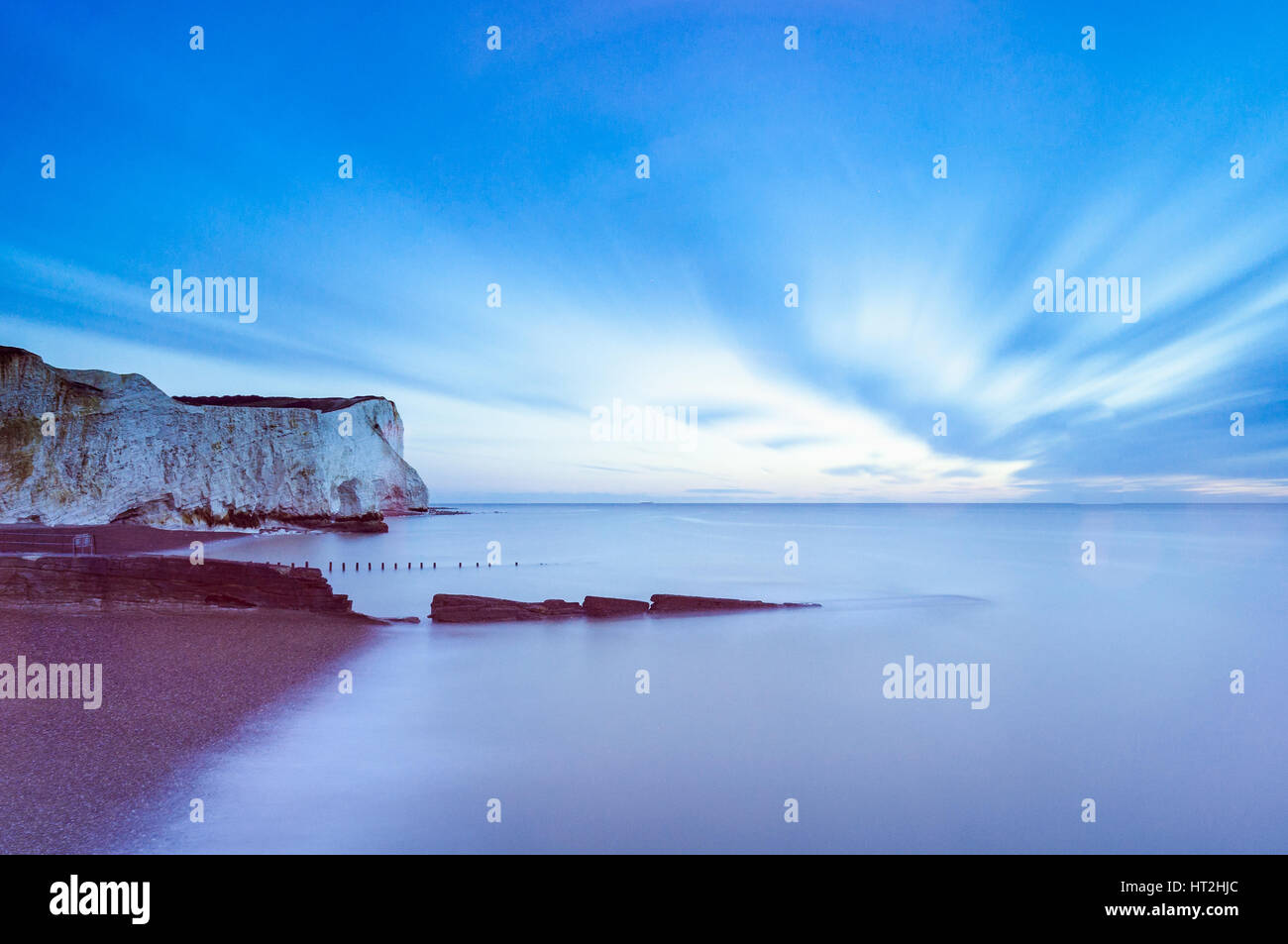 Sunrise at Seaford Head. Long exposure image with blown clouds and colour. Stock Photo