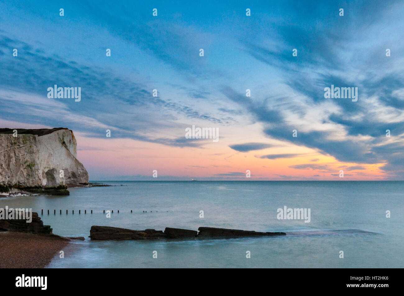 Sunrise at Seaford Head. Long exposure image with blown clouds and colour. Stock Photo