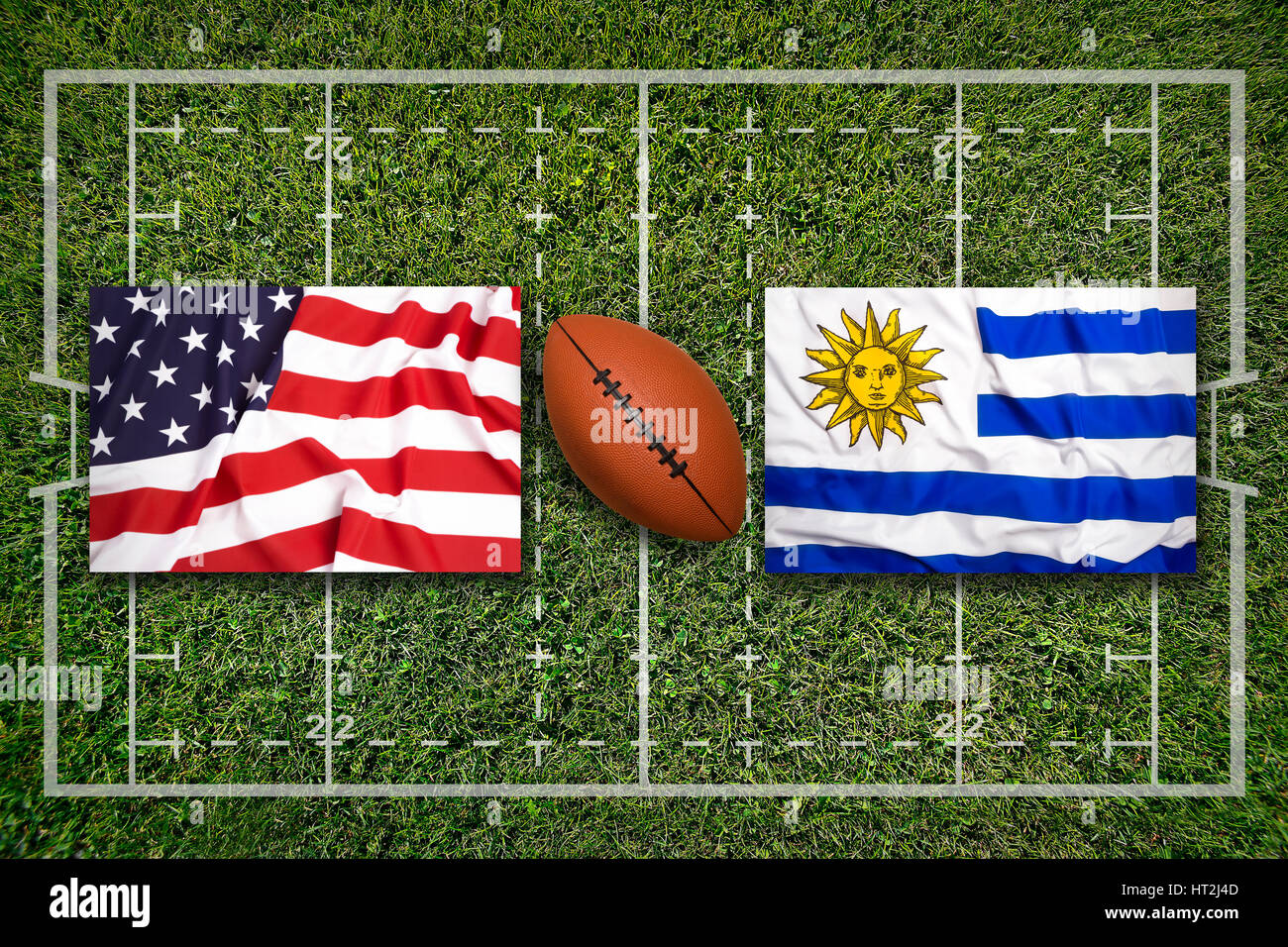 USA vs. Uruguay flags on green rugby field Stock Photo